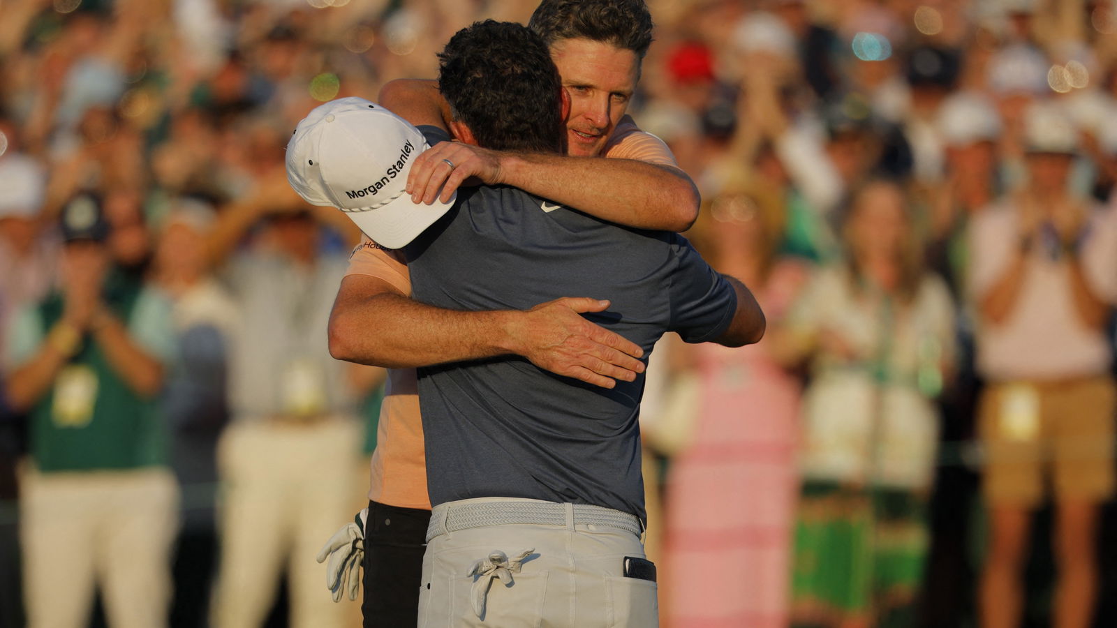Rose hugs McIlroy at The Masters